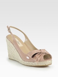 A signature bow adds feminine charm to this tall espadrille wedge in rich patent leather, backed by an adjustable slingback strap. Covered wedge, 3¾ (95mm)Covered platform, ½ (15mm)Compares to a 3¼ heel (80mm)Patent leather upperAdjustable slingback strapLeather liningRubber solePadded insoleMade in Italy A signature bow adds feminine charm to this tall espadrille wedge in rich patent leather, backed by an adjustable slingback strap. Covered wedge, 3¾ (95mm)Covered platform, ½ (15mm)Compares to a 3¼ heel (80mm)Patent leather upperAdjustable slingback strapLeather liningRubber solePadded insoleMade in Italy