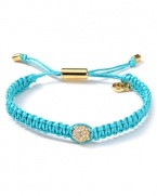 Tie on bold style with this wrap bracelet from MICHAEL Michael Kors. Crafted from woven cord and accented by a fireball station, it perfects effortless glamor.
