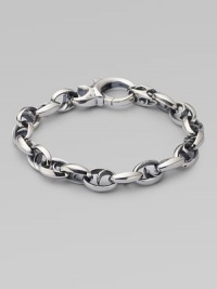 Bold oval links of polished sterling silver have not-so-sinister curved spikes in their centers.Sterling silver Length, about 8½ Lobster clasp Imported Bold oval links of polished sterling silver have not-so-sinister curved spikes in their centers.Sterling silver Length, about 8½ Lobster clasp Imported