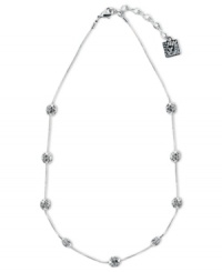 Anne Klein's sophisticated style provides endless style options. This Illusion design boasts numerous fireball accents embellished with sparkling crystals. Crafted in silver tone mixed metal. Approximate length: 16 inches + 2-inch extender. Anne Klein's sophisticated style provides endless style options. This Illusion design boasts numerous fireball accents embellished with sparkling crystals. Crafted in silver tone mixed metal. Approximate length: 16 inches + 2-inch extender.
