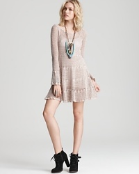 A soft cotton Free People dress pleases with boho bell sleeves and a femme flared skirt--hippie-chic with textured booties and beaded necklaces. A soft cotton Free People dress pleases with boho bell sleeves and a femme flared skirt--hippie-chic with textured booties and beaded necklaces.