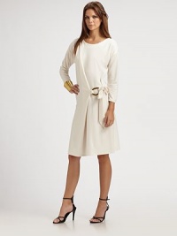 Exquisitely simple, this sophisticated design drapes across the front and ties at one side through a bold golden ring.Round necklineSide tiesThree-quarter sleeves with slightly dropped shouldersSoftly draped skirtPullover stylingAbout 37 from shoulder to hem41% tencel/23% cotton/23% modal/8% polyester/5% woolDry cleanImported Model shown is 5'9½ (176cm) wearing US size 4. Exquisitely simple, this sophisticated design drapes across the front and ties at one side through a bold golden ring.Round necklineSide tiesThree-quarter sleeves with slightly dropped shouldersSoftly draped skirtPullover stylingAbout 37 from shoulder to hem41% tencel/23% cotton/23% modal/8% polyester/5% woolDry cleanImported Model shown is 5'9½ (176cm) wearing US size 4.