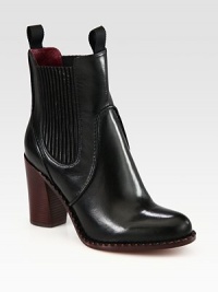 Elastic gores make for a comfortable leather design, upgraded with a contrasting block heel and scalloped edging. Stacked heel, 3¼ (80mm)Leather upperPull-on styleLeather lining and solePadded insoleImported Elastic gores make for a comfortable leather design, upgraded with a contrasting block heel and scalloped edging. Stacked heel, 3¼ (80mm)Leather upperPull-on styleLeather lining and solePadded insoleImported