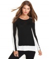 In graphic colorblocking, this BCBGMAXAZRIA top adds modern edge to your casual fall look!