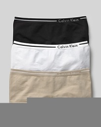 Calvin Klein Underwear seamless hipster. A comfortable seamless hipster logo and stripe detail on waistband. Cotton gusset. Style #D2890