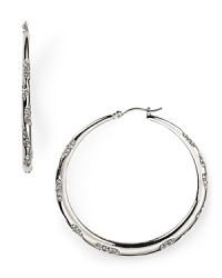 Sparkle and shine in these ABS by Allen Schwartz silver hoop earrings featuring scattered crystal stones that will light up the room. Sparkle and shine in these ABS by Allen Schwartz silver hoop earrings featuring scattered crystal stones that will light up the room.