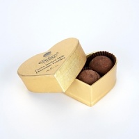 Lightly dusted milk chocolate truffles with a Marc de Champagne center. Lightly dusted milk chocolate truffles with a Marc de Champagne center.
