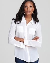 Satiny pockets and trim lend a hint of luxe to this GUESS top that transitions from the office to cocktail hour with effortless chic. Satiny pockets and trim lend a hint of luxe to this GUESS top that transitions from the office to cocktail hour with effortless chic.