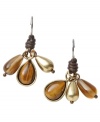 Reinvent your look with chic clusters in neutral tones. Fossil's petite drop earrings feature semi-precious tiger's eye, topaz glass, and a brass tone mixed metal teardrop wrapped with chocolate leather. Approximate drop: 1-1/4 inches.