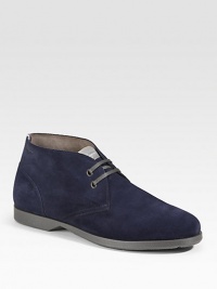 An ankle-high profile with two-eyelet construction in rich suede. Leather lining Padded insole Rubber sole Made in Italy 