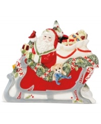 Make way for the sleigh! This holiday napkin holder from Fitz and Floyd adds instant cheer to ordinary essentials, sandwiching a stack of napkins or your favorite Christmas cards between Santa and winter scenery. Make way for the sleigh! This holiday napkin holder from Fitz and Floyd adds instant cheer to ordinary essentials, sandwiching a stack of napkins or your favorite Christmas cards between Santa and winter scenery.