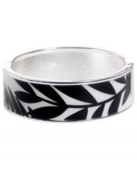 Channel the exoticism and energy of Brasil in Haskell's inspired skinny bangle. The Palm bangle features a black and white palm leaf print design, set in silver tone mixed metal with a hinge clasp. Approximate diameter: 2-1/2 inches. Approximate length: 8 inches. Item comes packaged in a turquoise gift box. Channel the exoticism and energy of Brasil in Haskell's inspired skinny bangle. The Palm bangle features a black and white palm leaf print design, set in silver tone mixed metal with a hinge clasp. Approximate diameter: 2-1/2 inches. Approximate length: 8 inches. Item comes packaged in a turquoise gift box.