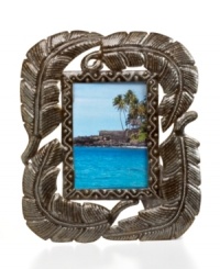 Picture yourself beneath a tropical palm, in this hand-cut, carved and finished frame. Four large fronds crafted of recycled steel and complemented by rich textural detail exemplify the talent and resourcefulness of Haiti's esteemed artisans. Picture yourself beneath a tropical palm, in this hand-cut, carved and finished frame. Four large fronds crafted of recycled steel and complemented by rich textural detail exemplify the talent and resourcefulness of Haiti's esteemed artisans.