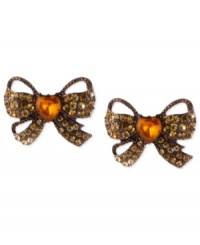 Tie these on for size. Betsey Johnson's stud earrings feature a whimsical bow motif with topaz-colored crystal accents and a heart detail in the center for a special touch. Crafted from brown gold-tone mixed metal. Approximate drop: 3/4 inch. Tie these on for size. Betsey Johnson's stud earrings feature a whimsical bow motif with topaz-colored crystal accents and a heart detail in the center for a special touch. Crafted from brown gold-tone mixed metal. Approximate drop: 3/4 inch.