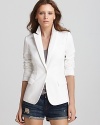 Crisp in white, this flawless Aqua blazer lends searing style--pair it with distressed jean shorts for a dressed-up take on casual Fridays.