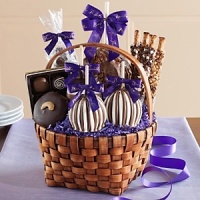 Arrive with a Mrs. Prindable's basket full of the flavors you've come to know and love! Comes with: a Jumbo Milk Chocolate Walnut Pecan apple, two Triple Chocolate Petite apples, one Triple Chocolate Caramel Favor, two Triple Chocolate Pretzels, a 4.5-oz Artisan Chocolate Caramel Gift Bag and a Dark Chocolate Cashew nut cluster. The deluxe version contains two extra Peanut Butter Pretzel rods, and a 4-Piece Truffle sampler. Arrive with a Mrs. Prindable's basket full of the flavors you've come to know and love! Comes with: a Jumbo Milk Chocolate Walnut Pecan apple, two Triple Chocolate Petite apples, one Triple Chocolate Caramel Favor, two Triple Chocolate Pretzels, a 4.5-oz Artisan Chocolate Caramel Gift Bag and a Dark Chocolate Cashew nut cluster. The deluxe version contains two extra Peanut Butter Pretzel rods, and a 4-Piece Truffle sampler.