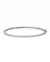 Keep your jewelry simple with Crislu's gold vermeil-finished bangle. When it's time to make a statement, layer this basic piece with similar styles for a sparkly stack-up. Keep your jewelry simple with Crislu's gold vermeil-finished bangle. When it's time to make a statement, layer this basic piece with similar styles for a sparkly stack-up.