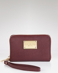 Tuck away your tech in an elegant case from MICHAEL Michael Kors. A gleaming logo plaque and sleek zip around closure seal the deal in style. Tuck away your tech in an elegant case from MICHAEL Michael Kors. A gleaming logo plaque and sleek zip around closure seal the deal in style.