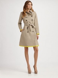 This classic trench style is trimmed with vibrant piping in an on-trend hue.Foldover collarGunflapDouble-breasted button frontSelf beltSide slash pocketsContrast trimBack rainflapFully linedAbout 37 from shoulder to hem82% cotton/18% silkDry cleanMade in France of imported fabricModel shown is 5'11 (180cm) wearing US size 4. This classic trench style is trimmed with vibrant piping in an on-trend hue.Foldover collarGunflapDouble-breasted button frontSelf beltSide slash pocketsContrast trimBack rainflapFully linedAbout 37 from shoulder to hem82% cotton/18% silkDry cleanMade in France of imported fabricModel shown is 5'11 (180cm) wearing US size 4.