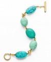 Add a touch of summer flavor all year long. A chic bracelet from the Lauren Ralph Lauren collection features bright semi-precious reconstituted turquoise stones strung together with a toggle closure. Crafted in gold tone mixed metal. Approximate length: 8 inches.