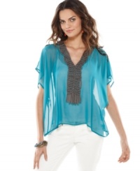 Inspired by sizzling Brasil style, this Bar III sheer-chiffon tunic will add a shot of color to your spring look! Inspired by sizzling Brasil style, this Bar III sheer-chiffon tunic will add a shot of color to your spring look!