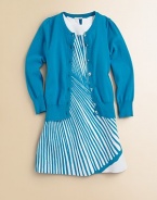 A classic long-sleeved cardigan is rendered in a soft knit and adorned with clear buttons and Pointelle trim for a timeless look.CrewneckLong sleevesButton frontPointelle detail at collar, buttons, cuffs and hem70% viscose/30% polyesterDry cleanImported Please note: Number of buttons may vary depending on size ordered. 