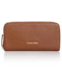 Get elegantly organized with this luxe lovely from Calvin Klein. Crafted from supple leather and accented with signature detailing, it flaunts multiple pockets for effortless go-everywhere accessorizing. Get elegantly organized with this luxe lovely from Calvin Klein. Crafted from supple leather and accented with signature detailing, it flaunts multiple pockets for effortless go-everywhere accessorizing.