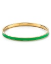 Go easy and green with this simply styled bangle from kate spade new york. Cast in glistening 12-karat gold, it's a stackable stroke of luck.