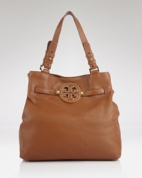 Tory Burch's leather tote is the daytime bag on every label lover's list. On weekends, this bag slips over a bold coat to lend a practical dose of chic. Tory Burch's leather tote is the daytime bag on every label lover's list. On weekends, this bag slips over a bold coat to lend a practical dose of chic.