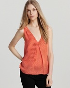 This unique Joie top is cut with a v neckline and scoop back, plus a demure pleat at the front. Paired with its diamond print, the chic style is an investment piece not worth passing up.
