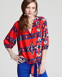 Join the trend-right tribe in this global-inspired Aqua blouse boasting buttons through the front and a knot at the hem for a playful, punchy look. Fashion is definitely fun again! Join the trend-right tribe in this global-inspired Aqua blouse boasting buttons through the front and a knot at the hem for a playful, punchy look. Fashion is definitely fun again!