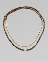 Beautifully textured, tiger's eye-inspired beads, radiant goldtone beads and a single rhinestone encrusted bead in a long strand, perfect for double-wrapping. Epoxy and brass beadsGlass stonesLength, about 24Slip-on styleImported 