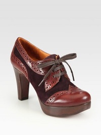 Suede and leather combine in this oxford-inspired design, pumped up with intricate cutouts and a stacked wooden heel. Stacked wooden heel, 3¾ (95mm)Stacked wooden platform, 1 (25mm)Compares to a 2¾ heel (70mm)Leather and suede upperLeather liningLeather sole with rubber insertPadded insoleMade in Spain Suede and leather combine in this oxford-inspired design, pumped up with intricate cutouts and a stacked wooden heel. Stacked wooden heel, 3¾ (95mm)Stacked wooden platform, 1 (25mm)Compares to a 2¾ heel (70mm)Leather and suede upperLeather liningLeather sole with rubber insertPadded insoleMade in Spain
