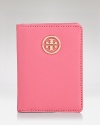 Get carded with this polished leather case from Tory Burch, which features a clear ID window, three card slots, and an understated logo detail.