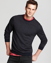 Knit entirely from soft merino wool, this clever design features thin stripes all over and solid elbow patches for unique flair. Knit entirely from soft merino wool, this clever design features thin stripes all over and solid elbow patches for unique flair.