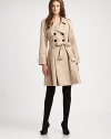 A cotton trenchcoat with feminine details and a waist-defining self-tie belt.Notched collarButton frontSelf-tie beltFully linedAbout 38 from shoulder to hemCottonDry cleanImported Model shown is 5'10 (177cm) wearing US size 4. 