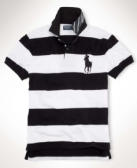 Cut for a trim, modern fit from breathable cotton mesh, a classic short-sleeved polo shirt exudes modern athleticism with bold pieced detailing. Cut for a trim, modern fit from breathable cotton mesh, a classic short-sleeved polo shirt exudes modern athleticism with bold pieced detailing.