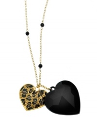 Love can be fierce. GUESS's double heart pendant necklace features a jet epoxy and leopard-printed heart with light Colorado topaz glass. Set in gold tone mixed metal. Approximate length: 33 inches + 2-inch extender. Approximate drops: 2 inches and 1-1/2 inches. Love can be fierce. GUESS's double heart pendant necklace features a jet epoxy and leopard-printed heart with light Colorado topaz glass. Set in gold tone mixed metal. Approximate length: 33 inches + 2-inch extender. Approximate drops: 2 inches and 1-1/2 inches.