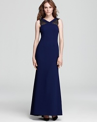 A high neck lends a modern feel to BCBGMAXAZRIA's v neck Evan gown, detailed in sheer lace for an alluring look. A high neck lends a modern feel to BCBGMAXAZRIA's v neck Evan gown, detailed in sheer lace for an alluring look.
