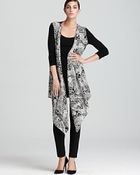 Lend an exotic touch to your everyday look with this DKNY cardigan alive with a rolling cascade of animal print. Solid contrast sleeves tame the statement print for the perfect style mix. Lend an exotic touch to your everyday look with this DKNY cardigan alive with a rolling cascade of animal print. Solid contrast sleeves tame the statement print for the perfect style mix.