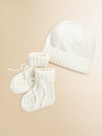Adorable baby's hat and bootie set knit in luxurious, ultra-soft cashmere. Hat Ribbed, foldover brimCinched top Booties Foldover ankle cuff with tie closureCashmereDry cleanImported Adorable baby's hat and bootie set knit in luxurious, ultra-soft cashmere. Hat Ribbed, foldover brimCinched top Booties Foldover ankle cuff with tie closureCashmereDry cleanImported