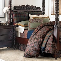 The casual camaraderie of long weekends spent with family and friends is articulated with warmth in a wardrobe of time-honored tartans and heathered tweeds. Highlighting the assembly is a feathery paisley updated with a surprising accent of bright blue that reappears on a lambswool blanket interwoven with an overscaled burgundy windowpane check. Twisted yarn fringes all sides of wool plaid shams. Tweed wool shams are bound with diamond-quilted ginger suede flanges. Cream tattersall sheets have deep upturned hems with double-needle topstitching. Wool throw pillows reiterate complementary plaids; each is uniquely finished in smooth leather, jacquard ribbon or dobby tape. The casual camaraderie of long weekends spent with family and friends is articulated with warmth in a wardrobe of time-honored tartans and heathered tweeds. Highlighting the assembly is a feathery paisley updated with a surprising accent of bright blue that reappears on a lambswool blanket interwoven with an overscaled burgundy windowpane check. Twisted yarn fringes all sides of wool plaid shams. Tweed wool shams are bound with diamond-quilted ginger suede flanges. Cream tattersall sheets have deep upturned hems with double-needle topstitching. Wool throw pillows reiterate complementary plaids; each is uniquely finished in smooth leather, jacquard ribbon or dobby tape.