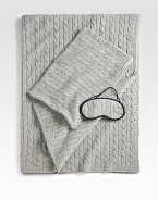 The ultimate in luxury and comfort, this soft, cable-knit set includes a travel blanket and sleep mask that tucks neatly into a matching carry case. Carry case doubles as a pillowcase for airline pillow. Pillow not included Four-ply yarn Carry case has zip closure Blanket, 36 X 60 Cashmere Dry clean Imported