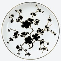 From Raynaud in Limoges porcelain, a modern, Asian-influenced pattern in black, white, and yellow with platinum bordering. Mix in yellow saucers and buffet plates to make the pattern pop.