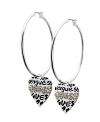Get chic, city style in urban-inspired hoops. GUESS's non-traditional hoop earrings feature a heart charm decorated with the company logo in scrawling graffiti and sparkling jet crystals. Crafted in silver tone mixed metal. Approximate drop: 1 inch. Approximate hoop diameter: 1-1/2 inches. Get chic, city style in urban-inspired hoops. GUESS's non-traditional hoop earrings feature a heart charm decorated with the company logo in scrawling graffiti and sparkling jet crystals. Crafted in silver tone mixed metal. Approximate drop: 1 inch. Approximate hoop diameter: 1-1/2 inches.