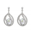 Polish your look with subtle refinement. Crystal Moonlight is encapsulated by intricate strands of clear Swarovski crystal pavé. This exquisite pair of silver tone mixed metal pierced earrings adds glamour to every look. Approximate drop: 1-3/8 inches.