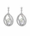 Polish your look with subtle refinement. Crystal Moonlight is encapsulated by intricate strands of clear Swarovski crystal pavé. This exquisite pair of silver tone mixed metal pierced earrings adds glamour to every look. Approximate drop: 1-3/8 inches.