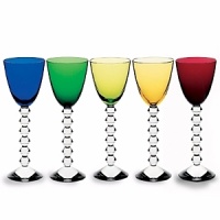 Designed for todays contemporary lifestyle and expression of personal entertaining styles. Simple, easy to integrate and multi-functional, each piece is an exemplary marriage of beauty and practicality that is sure to delight with each use. Shown left to right: vega Rhine wine glasses in cobalt, emerald, olive, topaz, ruby; also available in sapphire and clear.