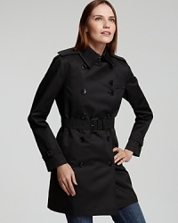 Always ultra sleek and sophisticated, this iconic Burberry trench finishes any outfit with unabashed elegance.