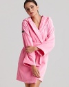 Plush, absorbent, and colorful women's robe with a hood and large bouclé croc on the shoulder.